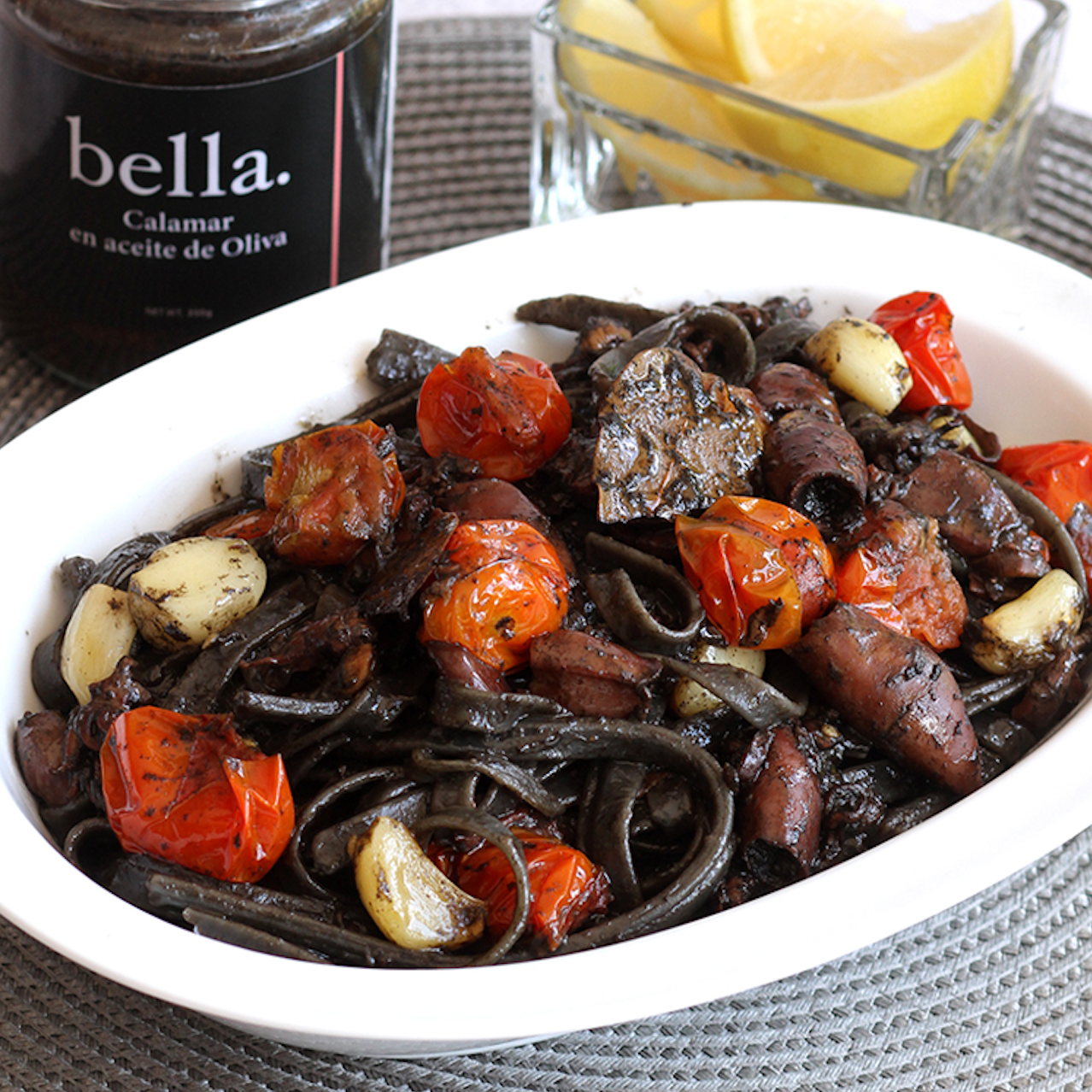 Squid Ink Linguine with Calamar en Aceita de Oliva with Roasted Garlic and Tomato