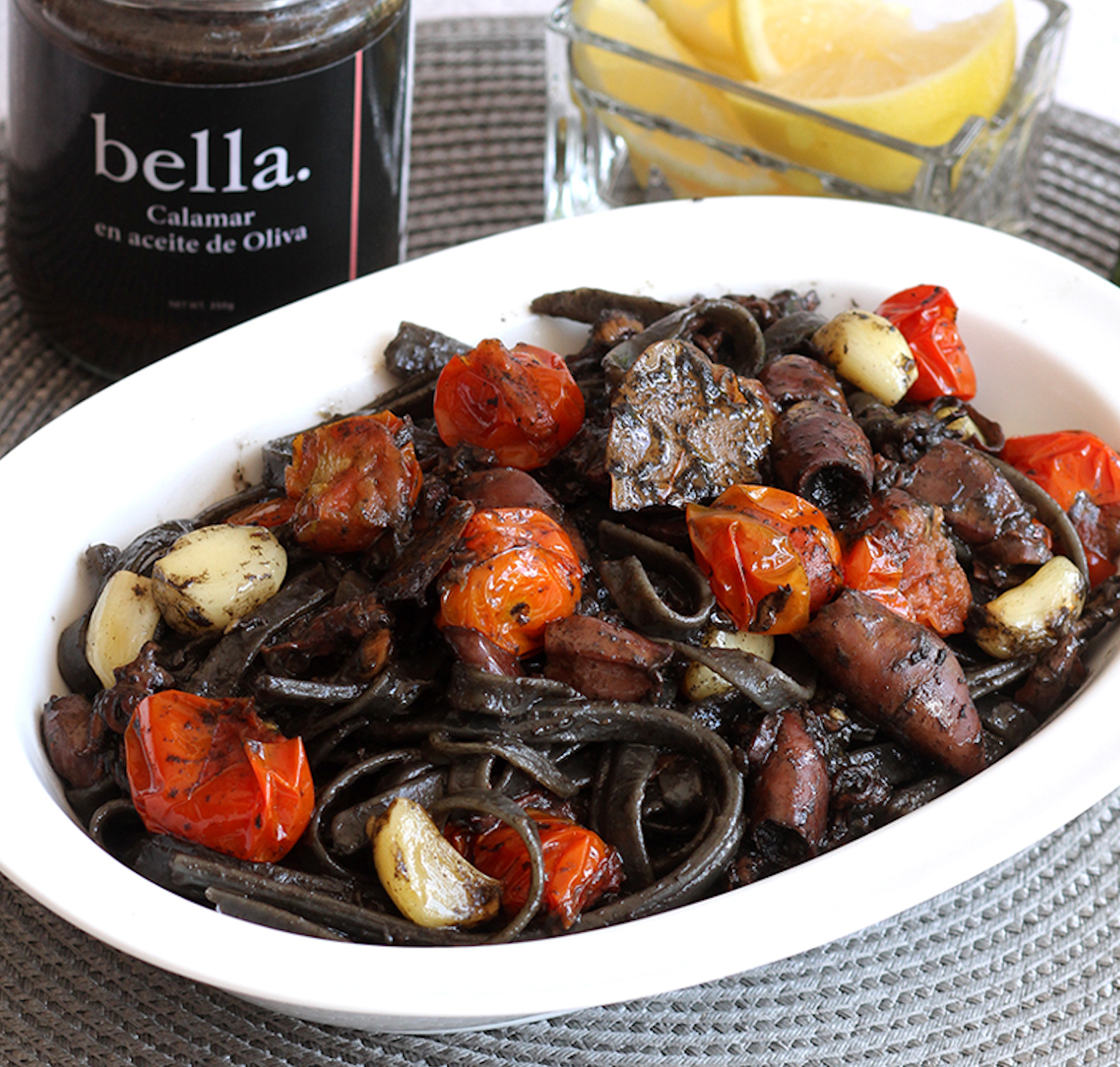 Squid Ink Linguine with Calamar en Aceita de Oliva with Roasted Garlic and Tomato